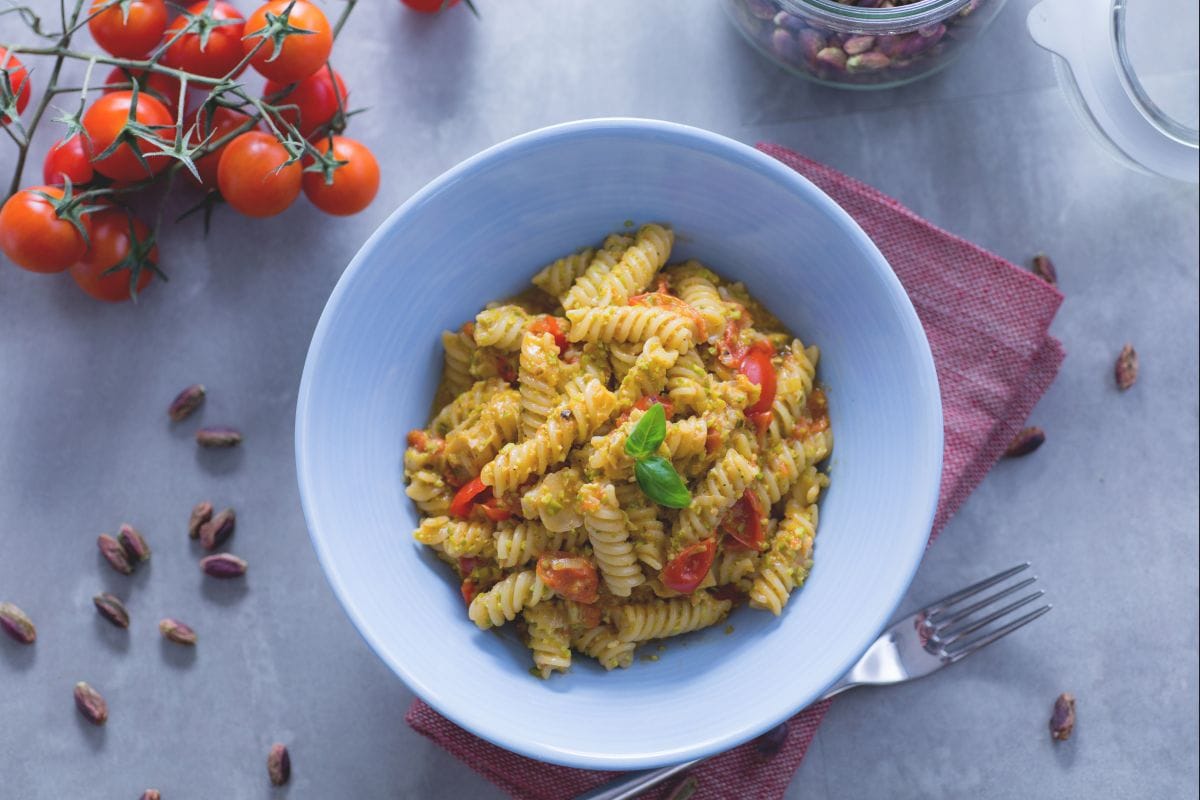 Fusilli pasta with pistachio pesto and cherry tomatoes - Italian recipes by  GialloZafferano