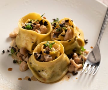 Stuffed Pappardelle with Pea, Rabbit Ragù, and Olives