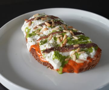 Bruschetta with Roasted Red Pepper Cream, Burrata, and Anchovies