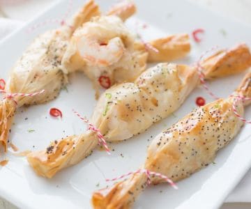 Christmas parcels with scampi, ginger, and lime