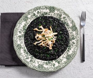 Squid ink risotto with sautéed cuttlefish