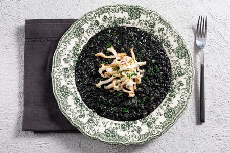 Squid ink risotto with sautéed cuttlefish