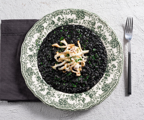 Squid ink risotto with sautéed cuttlefish