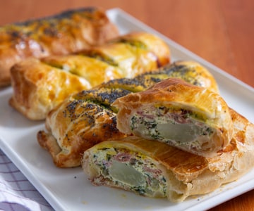 Mini savory strudels with chard, ricotta, and speck