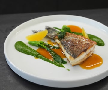 Sea bass with orange sauce and broccoli rabe purée