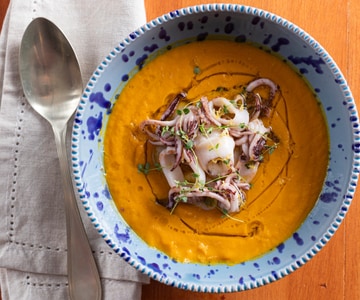 Carrot and ginger velouté with seared baby squid