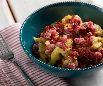 Pasta with leek cream, saffron, and Bra sausage